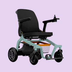 Black electric wheelchair with green frame on a light purple background