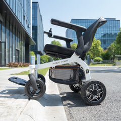 Robooter E30 electric powerchair navigating over grassy terrain with ease